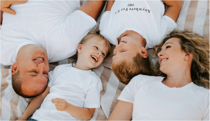 family of four smiling
