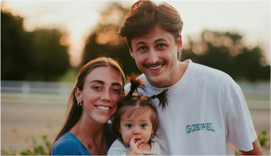 family of three smiling